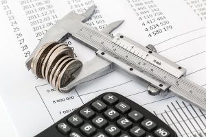 Kansas Debt Elimination Canva Coins and Calculator on a Invoice 1 300x200